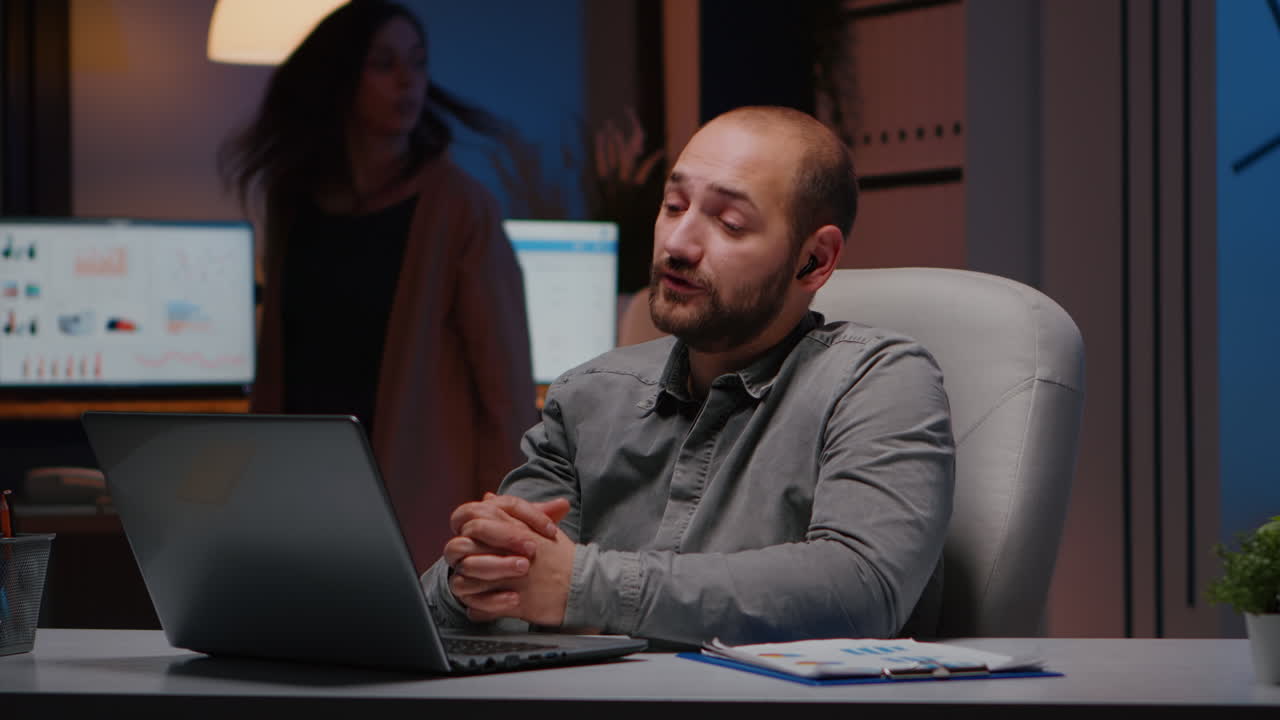 Businessman wearing headphone during company teammeeting conference