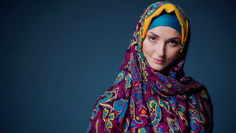 close-up portrait of a woman in a colorful hijab