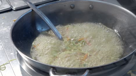 cooking noodles in a wok
