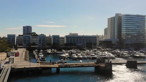 Drone-shot-paralaxing-by-the-marina-in-Troia,-Portugal