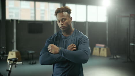 portrait of a fit man in a gym