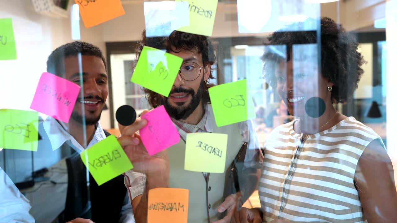 Diverse team collaborating on ideas in a modern office