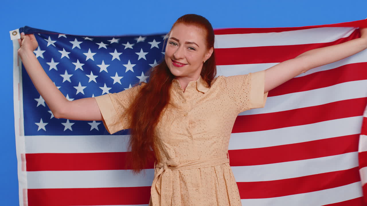 Woman waving and wrapping in american usa flag celebrating human rights and freedoms independence