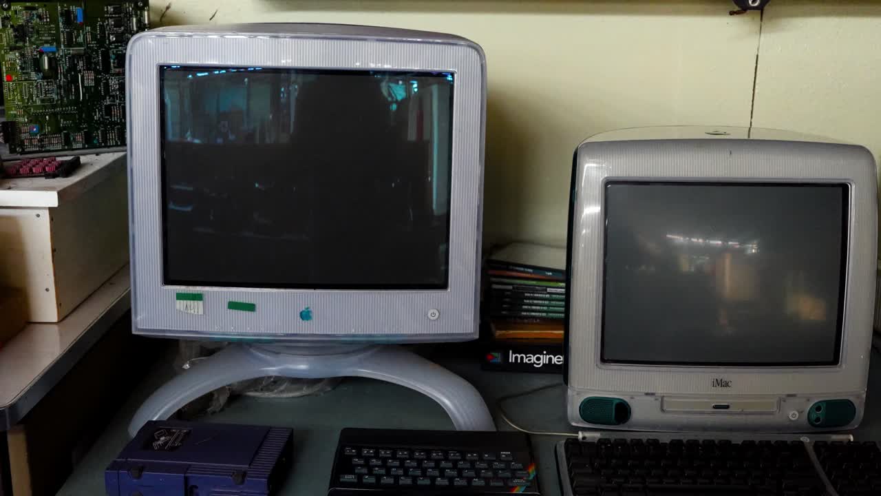 Old vintage Apple Mac Imac computer inside room in 1998. Close up zoom shot. Start of developing modern technology theme.