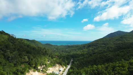 a road down in the valley follows to the ocean