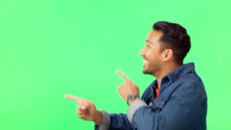 hombre asiático, señalando y bailando en la pantalla verde