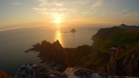 time lapse of midnight sun on the famous peak matinden, northern norway