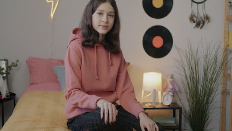 teenage girl in cozy bedroom