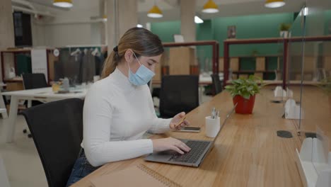 woman paying online in modern office
