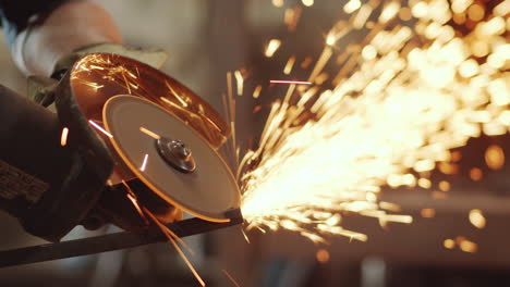 Close-Up-of-Worker-Using-Cutting-Wheel-with-Sparks