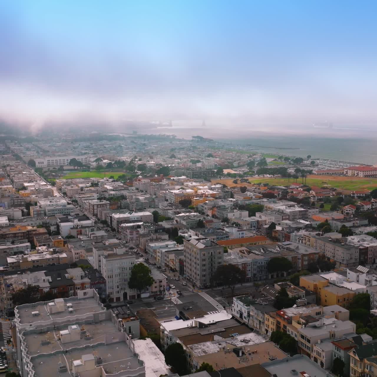 Amazing urban scenery with rich architecture on sunny daytime. San Francisco panorama being coated with thick fog
