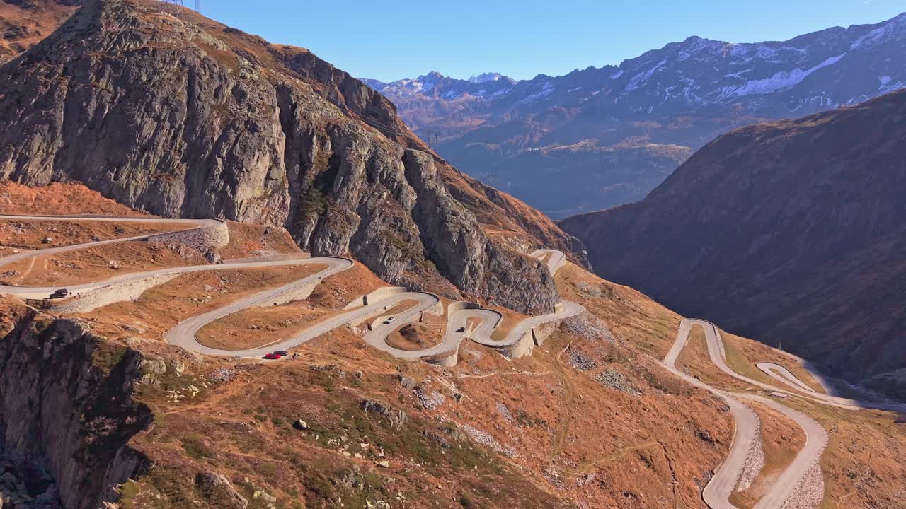Sports car on Tremola Road's winding bends, aerial view, Switzerland