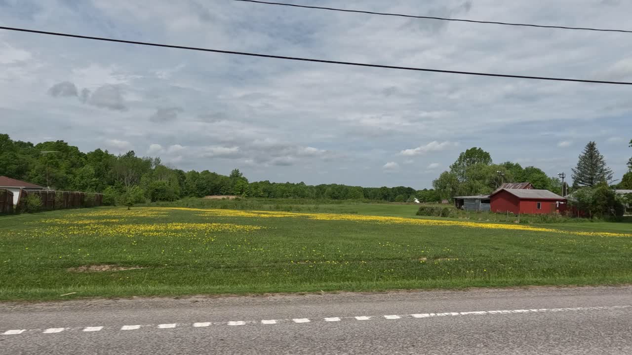 Dolly in small country town during cloudy day.