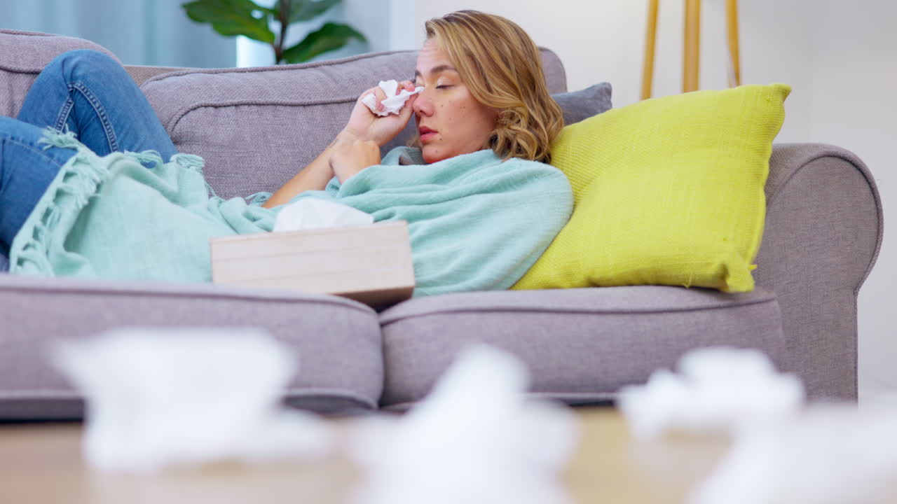 Crying, tissue and sad woman wipe tears in home