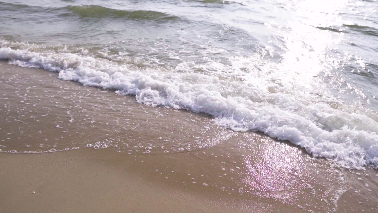 Slow Motion . Waves at sunset, Ocean Beach in pattaya Thailand .