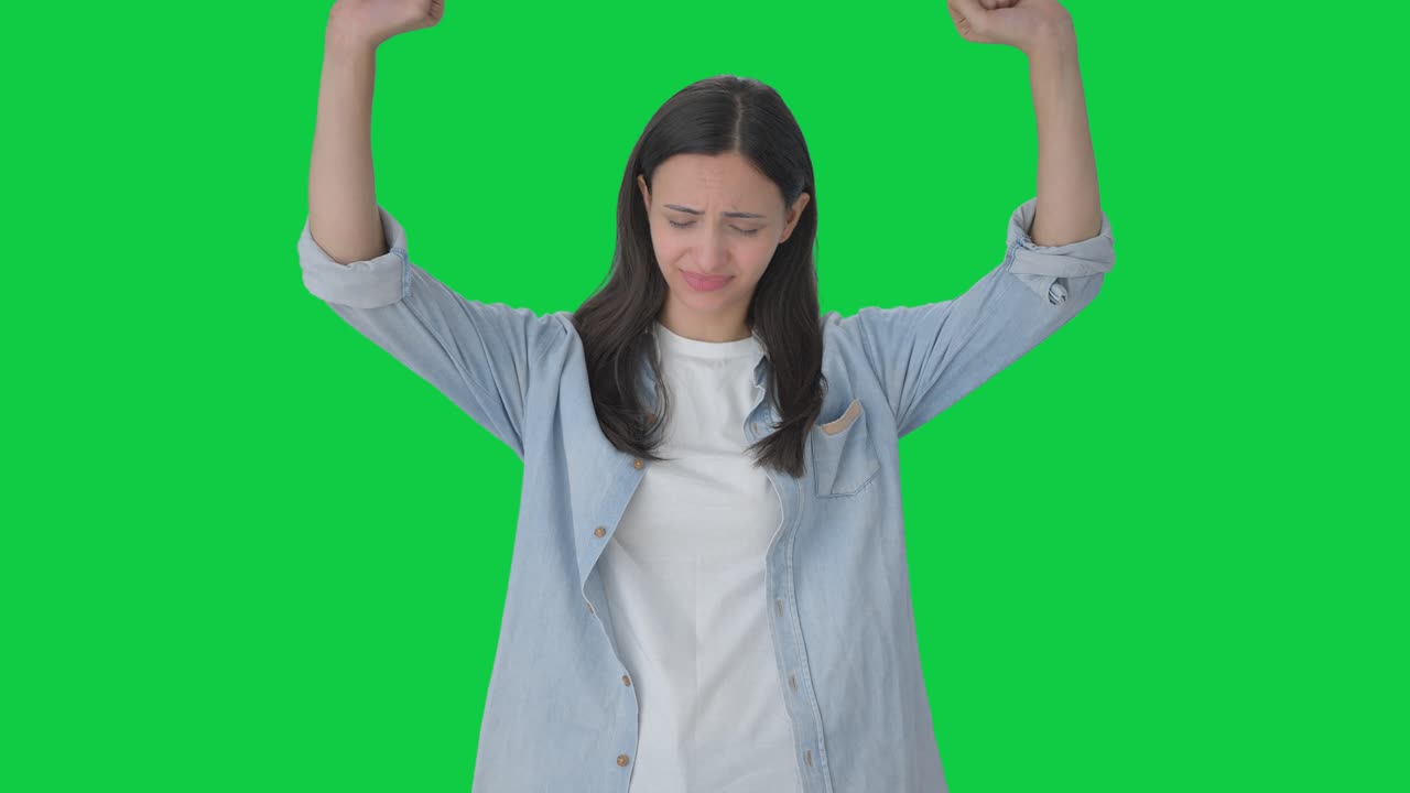 Tired and lazy Indian girl yawning Green screen