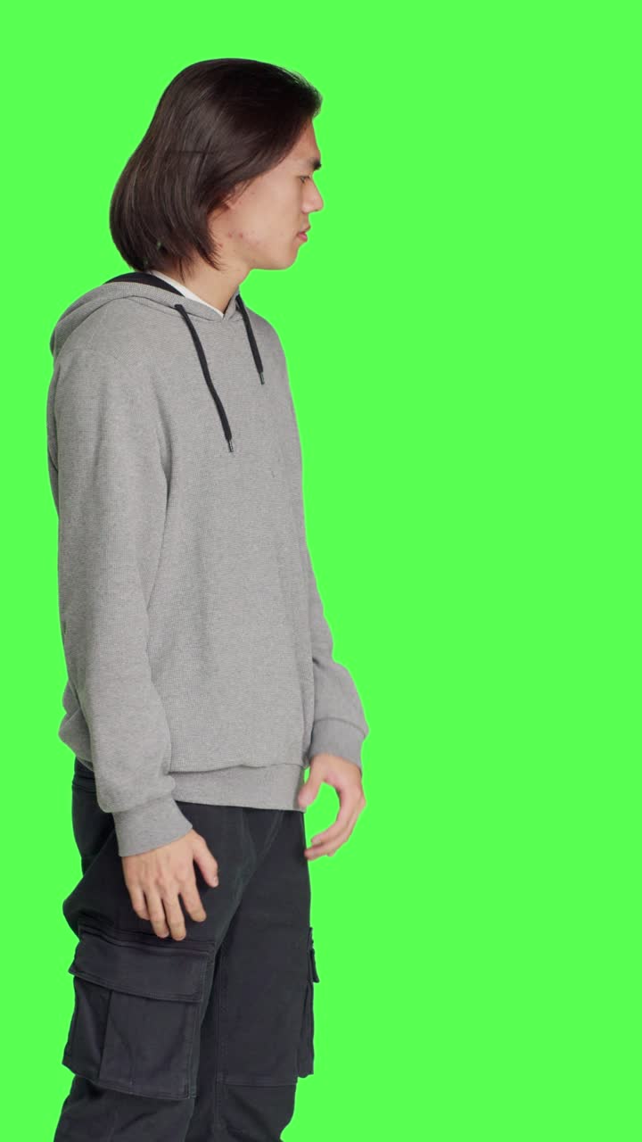 Side view of model pretending to push something aside