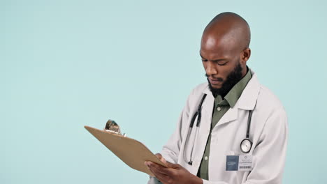 Black-man,-doctor-and-writing-on-clipboard