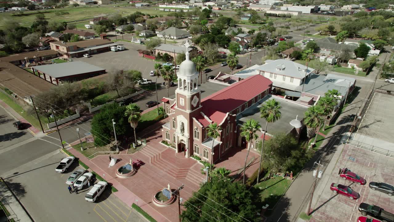 Ascending aerial view of &amp;quot;Our Lady of Guadalup&amp;quot; Church, one of the oldest landmarks in Mission, Texas, dating back to 1899