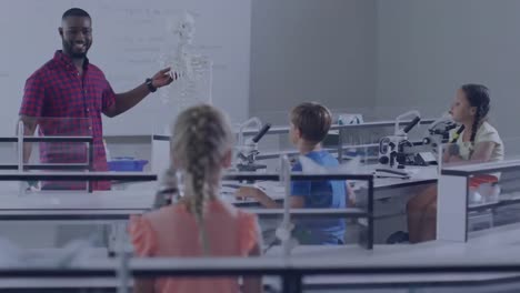 Animation-of-molecular-structures-over-happy-african-american-male-teacher-and-pupils-in-class