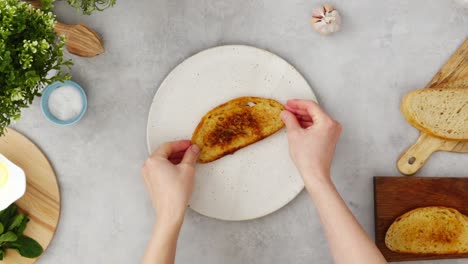 crop person preparing avocado toast for breakfast in kitchen