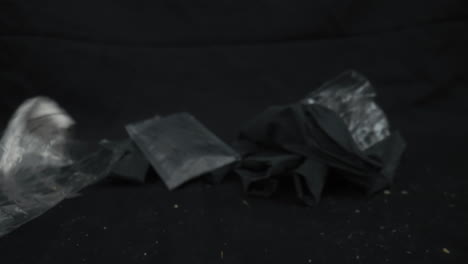 it is the image of garbage spilled on a black background