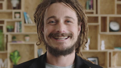 close-up-portrait-of-young-attractive-carefree-man-with-dreadlocks-smiling-confident-successful-entrepreneur