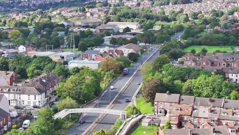 traffic on two lane highway near residential landscape in rotherham in south yorkshire, england