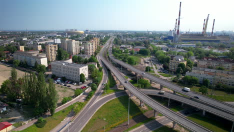 Highway-traffic-in-various-directions-on-highway-overpass,-Gdansk,-aerial