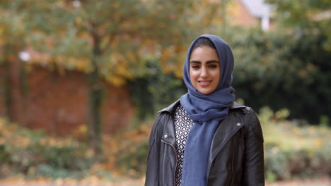 Portrait-Of-British-Muslim-Woman-In-Urban-Park