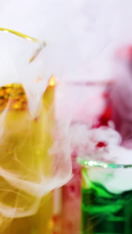 vibrant liquids reacting with smoke and bubbles