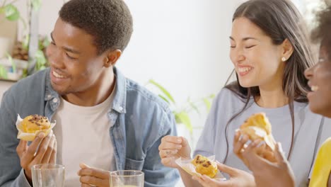 friends enjoying muffins and good company