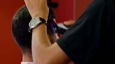 man getting his hair cut by hairdresser 4k