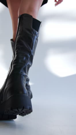 black leather over-the-knee platform boots