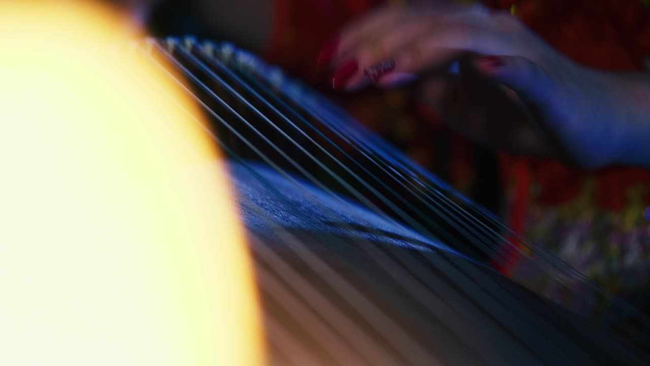 Chinese Girl Playing Guzheng Indoor