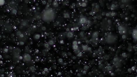 slow motion snow on black background