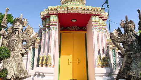 statue and temple entrance in bangkok, thailand