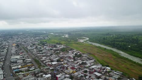 aerial view of a town near a river in latin america