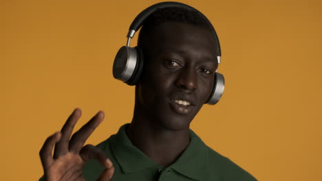 African-american-man-on-yellow-background.