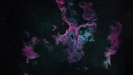 long shot of a beautiful green and purple gaseous nebula in deep space