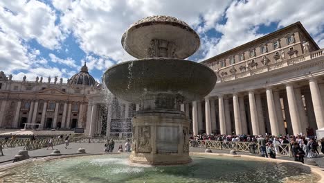 crowds gather around a large fountain in europe