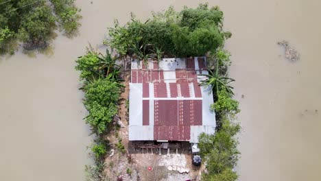 above view of rustic homes on a flooded town near sylhet, bangladesh. aerial drone shot