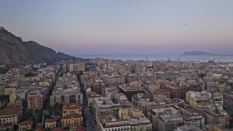 palermo italy aerial v4 cinematic drone flyover via principe di paternò street capturing charming urban cityscape, marina shipyard and tyrrhenian sea at sunset dusk - shot with mavic 3 cine - may 2023