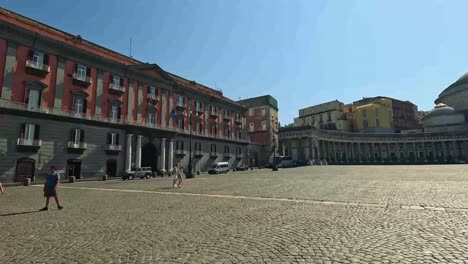 people walking in a historic naples square