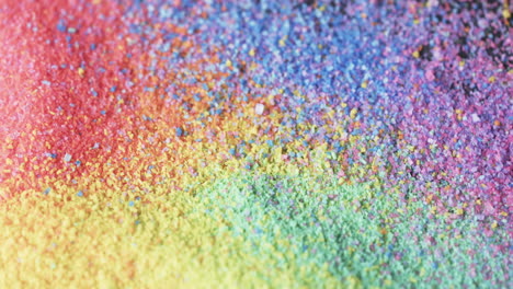 video de primer plano de los granos de arena de color arco iris y copia del fondo del espacio