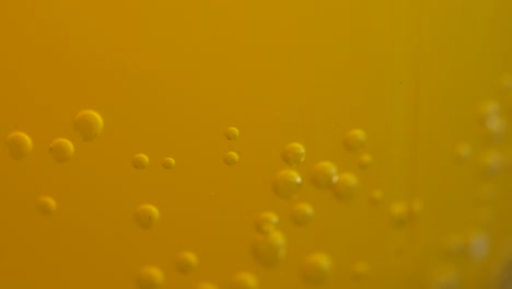 bubbles in a yellow liquid