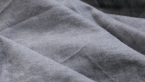 close-up silky fine gray jeans details slow tilt