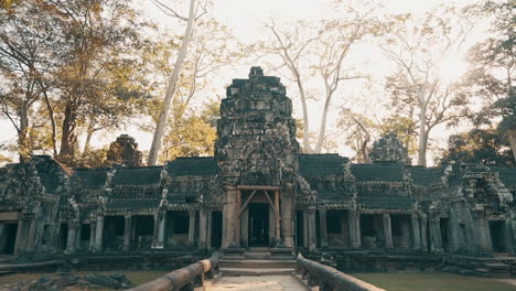 approaching the front gates of ta prohm monastery, siem reap cambodia, slow motion
