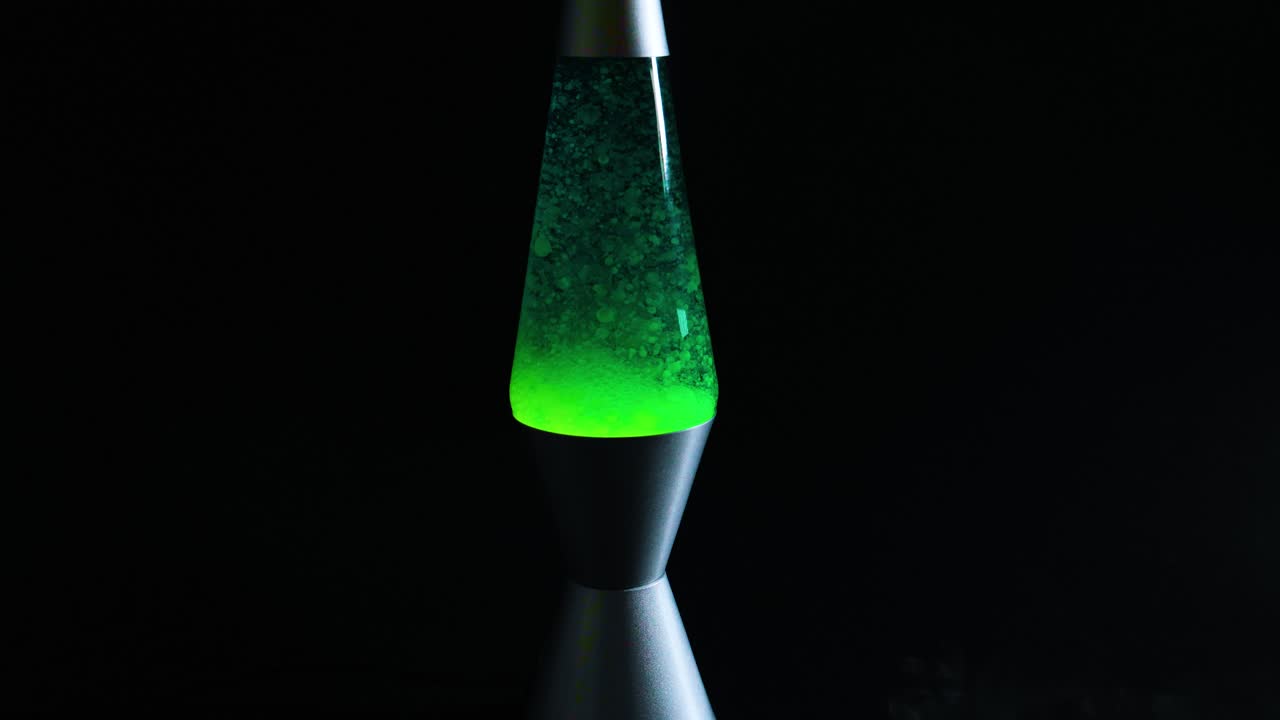 Green lava lamp with moving wax blobs
