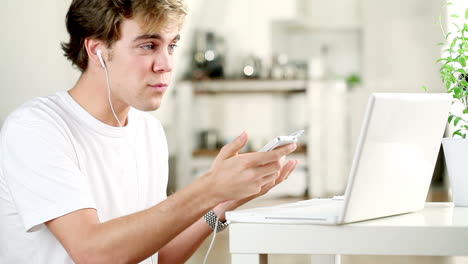 young-man-listening-to-music-at-home